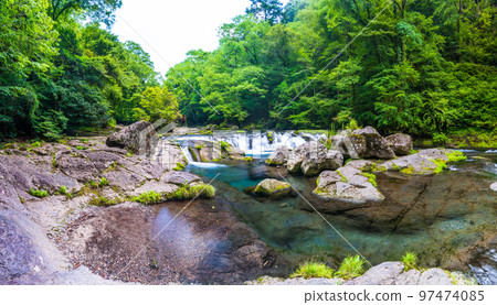 Summer scenery of beautiful mountain streams, valleys and clear streams ``Tourist attraction: Kikuchi Gorge'' Kikuchi City, Kumamoto Prefecture, Japan Summer scenery of beautiful mountain streams, valleys and clear streams ``Tourist attraction: Kikuchi Gorge'' Kikuchi City, Kumamoto Prefecture, Japan 97474085
