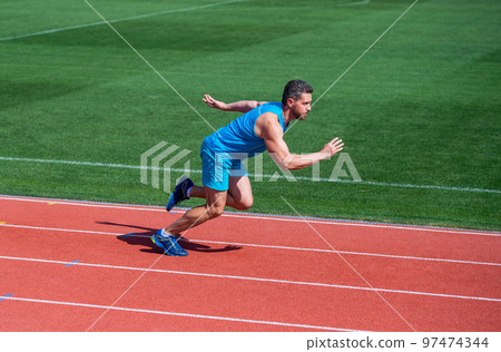 Runner at finish. Athlete runner prepare to race at stadium. Running tips for beginners. 97474344