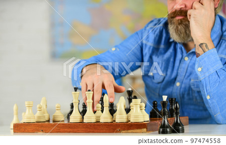 Chess is life in miniature. Chess lesson. Strategy concept. School teacher. Board game. Playing chess. Intellectual hobby. Figures on wooden chess board. Thinking about next step. Development logics 97474558