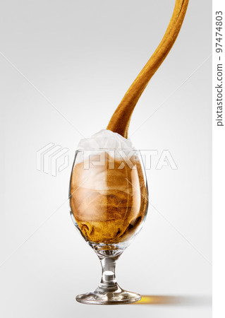 Creative artwork with glass of light beer made from yellow and white cloth imitating real beer drink. Imagination, art, Oktoberfest, ideas, ad Creative artwork with glass of light beer made from yellow and white cloth imitating real beer drink. Imagination, art, Oktoberfest, ideas, ad 97474803