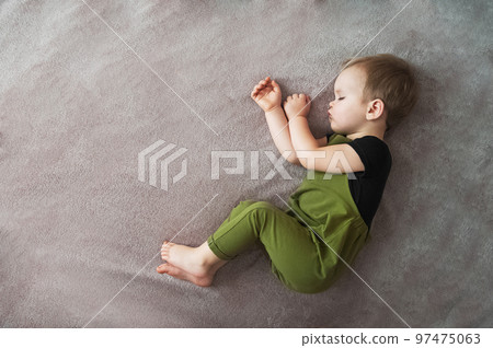 Toddler boy sleeping close-up. bedtime. baby lifestyle. Toddler boy sleeping close-up. bedtime. baby lifestyle. 97475063