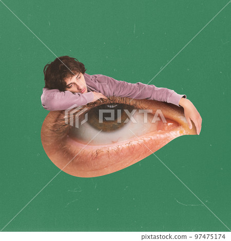 Contemporary art collage. Conceptual image. Sad, depressed young boy lying on human eye. Feeling tired. Breakdown Contemporary art collage. Conceptual image. Sad, depressed young boy lying on human eye. Feeling tired. Breakdown 97475174