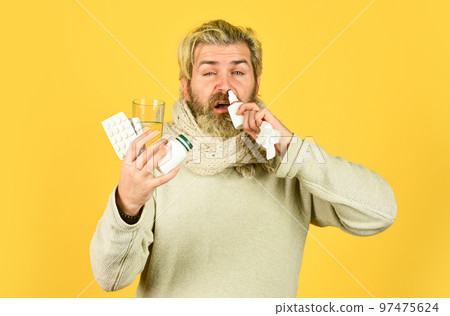 Medicines effective treatment. Pharmacy concept. Lot of medicines. Man sick leave at home. Bearded guy messy hair hold pills tablets vitamins medicines in hands. Bottle blister plastic container Medicines effective treatment. Pharmacy concept. Lot of medicines. Man sick leave at home. Bearded guy messy hair hold pills tablets vitamins medicines in hands. Bottle blister plastic container 97475624