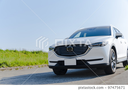 white SUV type passenger car white SUV type passenger car 97475671