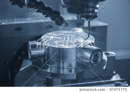 The 5-axis CNC milling machine  hole cutting on the metal  part. 97475778