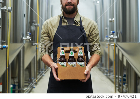 Brewer Showing Bottled Beer Brewer Showing Bottled Beer 97476421