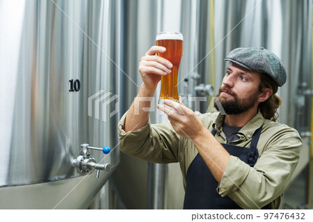 Brewer Checking Quality of Drink 97476432