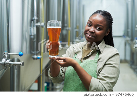 Brewery Worker Showing Beer 97476460
