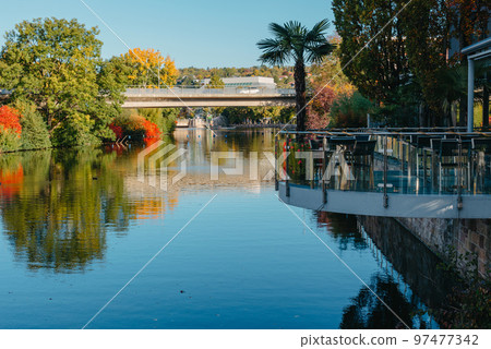 River On Sunset. Townhouses Buildings And Multi-floor Home At Waterfront. Sunset On River In City. Suburb Houses And Residential Building Near River In Europe. House In Nature On Shore On Sunset. River On Sunset. Townhouses Buildings And Multi-floor Home At Waterfront. Sunset On River In City. Suburb Houses And Residential Building Near River In Europe. House In Nature On Shore On Sunset. 97477342