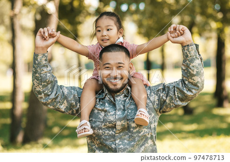Officer spending time with his daughter and looking happy and excited Officer spending time with his daughter and looking happy and excited 97478713