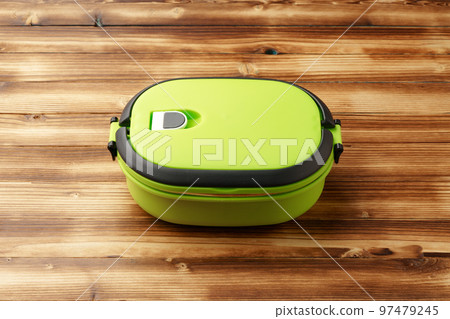 New empty plastic lunch box on a wooden background New empty plastic lunch box on a wooden background 97479245