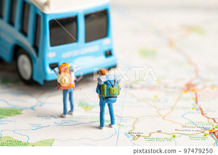 Traveler with backpack walking to car on map, transport travel tour concept. Traveler with backpack walking to car on map, transport travel tour concept. 97479250