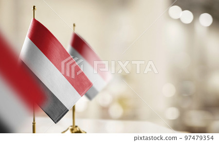 Small flags of the Yemen on an abstract blurry background Small flags of the Yemen on an abstract blurry background 97479354