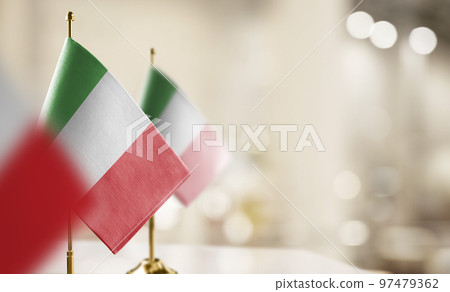 Small flags of the Italy on an abstract blurry background 97479362