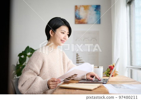 Young female creator working in the office 97480211