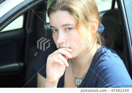 Female expressions in her new car. Female expressions in her new car. 97482249