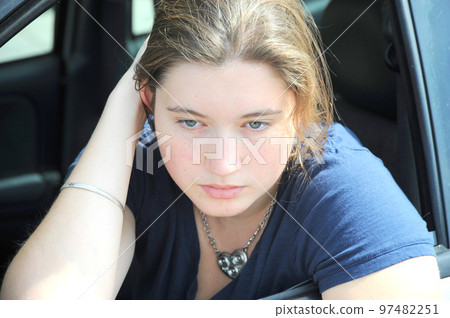 Female expressions in her new car. Female expressions in her new car. 97482251