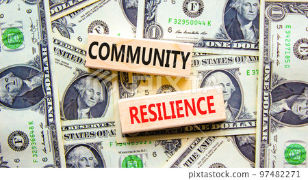 Community resilience symbol. Concept word Community resilience typed on wooden blocks. Beautiful background from dollar bills. Business and community resilience concept. Copy space. Community resilience symbol. Concept word Community resilience typed on wooden blocks. Beautiful background from dollar bills. Business and community resilience concept. Copy space. 97482271