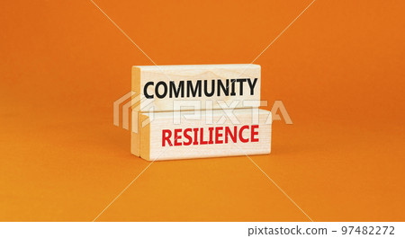Community resilience symbol. Concept word Community resilience typed on wooden blocks. Beautiful orange table orange background. Business and community resilience concept. Copy space. 97482272