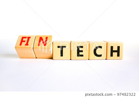 Tech or fintech symbol. Concept word Tech and Fintech on wooden cubes. Beautiful white table white background. Business and tech or fintech concept. Copy space. 97482322