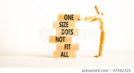 One size does not fit all symbol. Concept words One size does not fit all on wooden blocks. Businessman hand. Beautiful white background. One size does not fit all business concept. Copy space. One size does not fit all symbol. Concept words One size does not fit all on wooden blocks. Businessman hand. Beautiful white background. One size does not fit all business concept. Copy space. 97482328