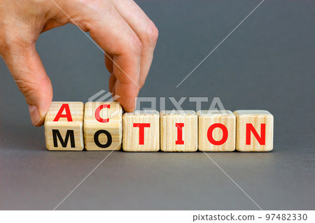Action or motion symbol. Concept word Motion and Action on wooden cubes. Businessman hand. Beautiful grey table grey background. Business and action or motion concept. Copy space. Action or motion symbol. Concept word Motion and Action on wooden cubes. Businessman hand. Beautiful grey table grey background. Business and action or motion concept. Copy space. 97482330