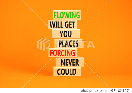 Flowing symbol. Concept words Flowing will get you places forcing never could on wooden blocks. Beautiful orange background copy space. Business motivational flowing concept. Flowing symbol. Concept words Flowing will get you places forcing never could on wooden blocks. Beautiful orange background copy space. Business motivational flowing concept. 97482337