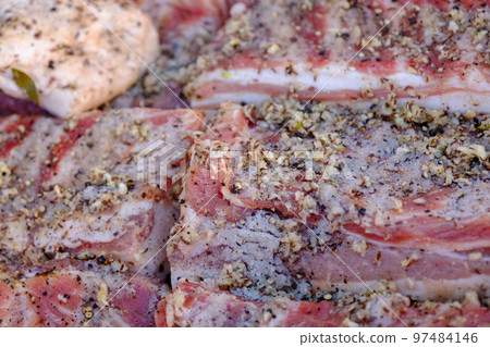 Large pieces of salted bacon. According to traditional Ukrainian recipes. Handmade trade in the rural market. Large pieces of salted bacon. According to traditional Ukrainian recipes. Handmade trade in the rural market. 97484146