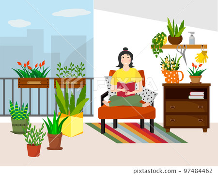 The girl is sitting on the sofa with a book. Balcony home garden with flowers and seedling boxes, chest of drawers and furniture.  97484462
