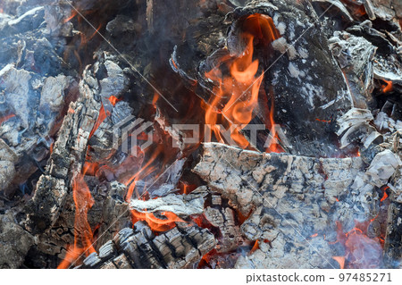 Ash embers of bonfire after fire has been burned wood prepared for BBQ cooking 97485271