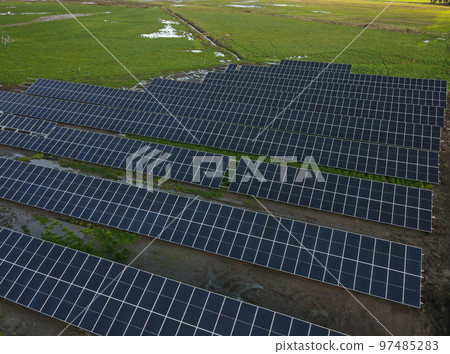 Aerial view of solar power plant solar panels. Electric panels for producing clean ecologic energy. Aerial view of solar power plant solar panels. Electric panels for producing clean ecologic energy. 97485283
