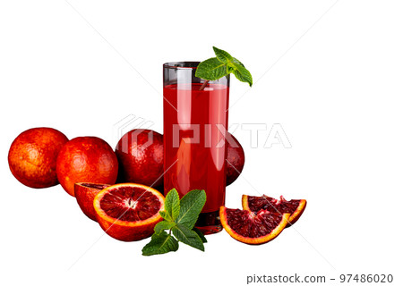 Glass of juice with a some pieces of sicillian orange drink on a white isolated background. 97486020