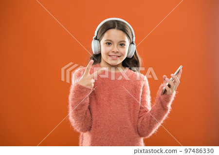 Enjoy music concept. Best music apps that deserve a listen. Girl child listen music modern headphones and smartphone. Listen for free. Get music family subscription. Access to millions of songs Enjoy music concept. Best music apps that deserve a listen. Girl child listen music modern headphones and smartphone. Listen for free. Get music family subscription. Access to millions of songs 97486330