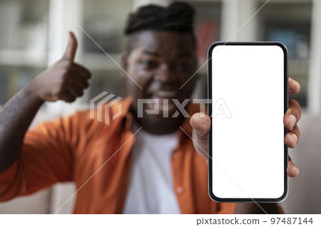 Happy Black Man Showing Big Phone With Empty Screen 97487144