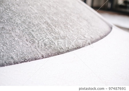 Close-up of snow frozen on a car. The concept of weather conditions 97487691