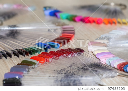 Nail polish color samples in shape of fan with metal ring Nail polish color samples in shape of fan with metal ring 97488203