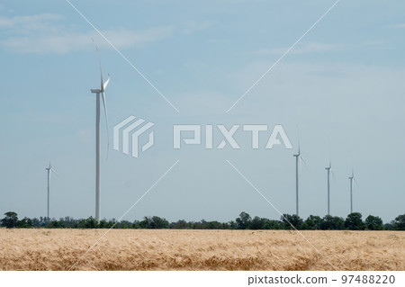 Ecofriendly windmills producing renewable energy on field Ecofriendly windmills producing renewable energy on field 97488220