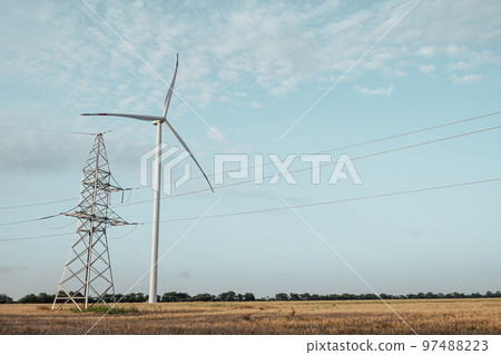 Ecofriendly wind turbine produces renewable energy by tower 97488223