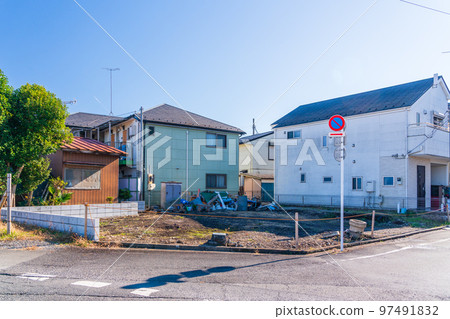 A vacant lot on a corner lot due to demolition of a building 97491832