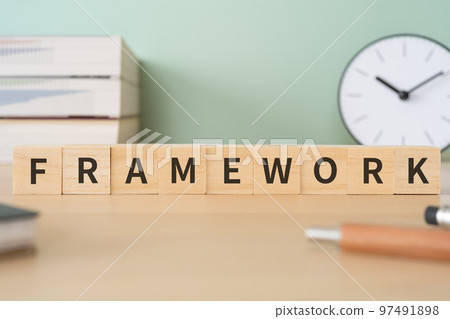 A desk with a block written as FRAMEWORK 97491898