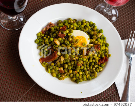 Appetizing dish of peas with ham Appetizing dish of peas with ham 97492087