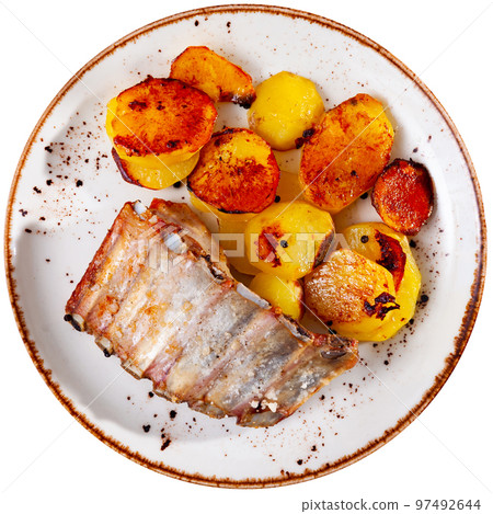 Fried juicy pork with boiled potatoes served on plate Fried juicy pork with boiled potatoes served on plate 97492644