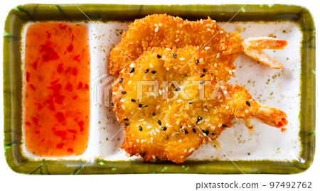 Fried prawns in tempura batter and sesame Fried prawns in tempura batter and sesame 97492762
