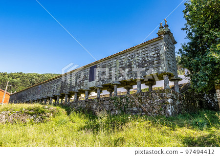 The long and narrow grain store, horreo at Lira in Galicia, Spain. The long and narrow grain store, horreo at Lira in Galicia, Spain. 97494412
