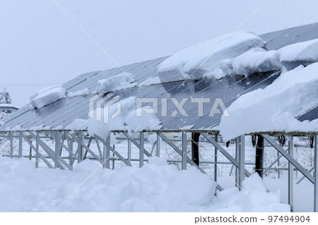 Snow-covered solar panels power generation snow country winter 97494904