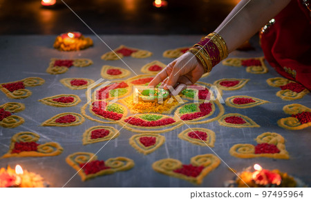 Happy Diwali - Diya lamps lit during diwali celebration 97495964