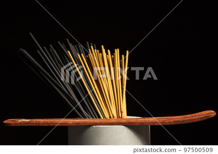 Many different incense sticks with wooden stand Many different incense sticks with wooden stand 97500509