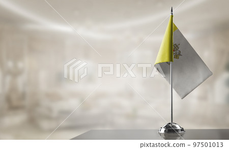 A small Vatican flag on an abstract blurry background 97501013