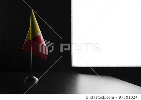Small national flag of the Bhutan on a black background Small national flag of the Bhutan on a black background 97501024