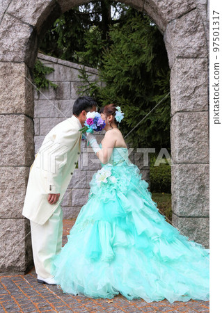 Bride and groom in wedding dress and tuxedo, wedding photo in middle age marriage Bride and groom in wedding dress and tuxedo, wedding photo in middle age marriage 97501317